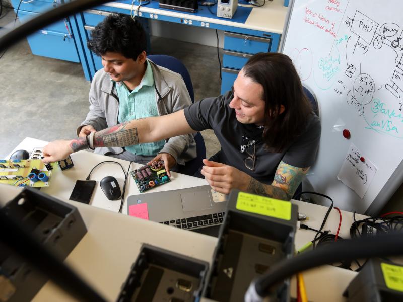 Two individuals working in a lab.