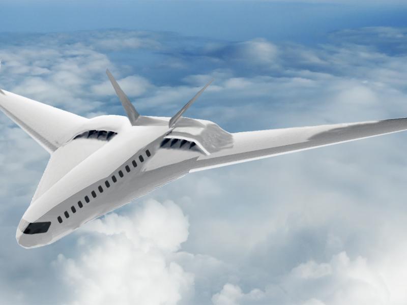 A sleek white aircraft flies above white clouds.