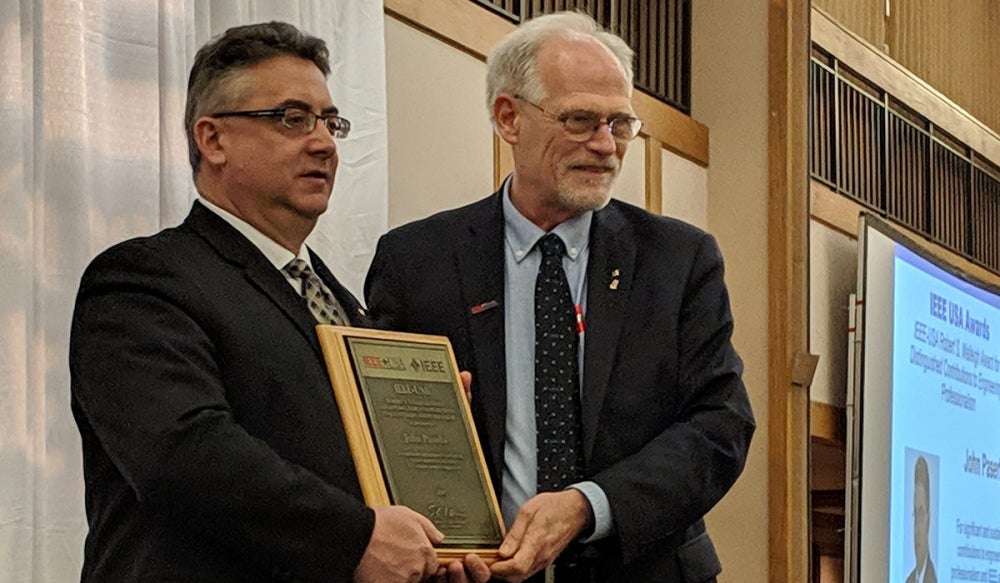 Pictured above: John Paserba (left) receives the 2018 Walleigh Award from 2019 IEEE-USA President Tom Coughlin at the IEEE Region 3 Southeastcon in Huntsville, Ala.